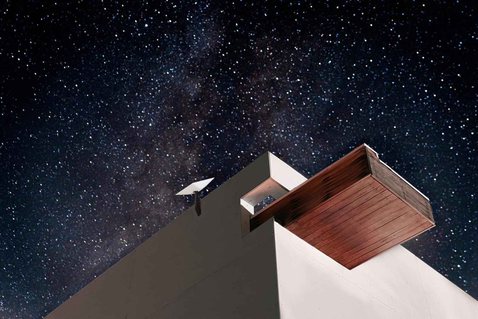 Starlink rooftop terminal on an enterprise site at night