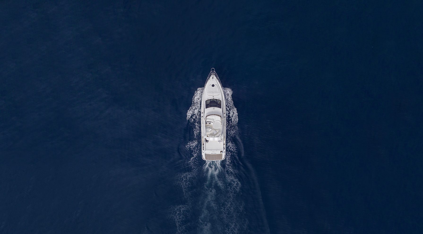 Motor yacht underway with maritime satellite connectivity